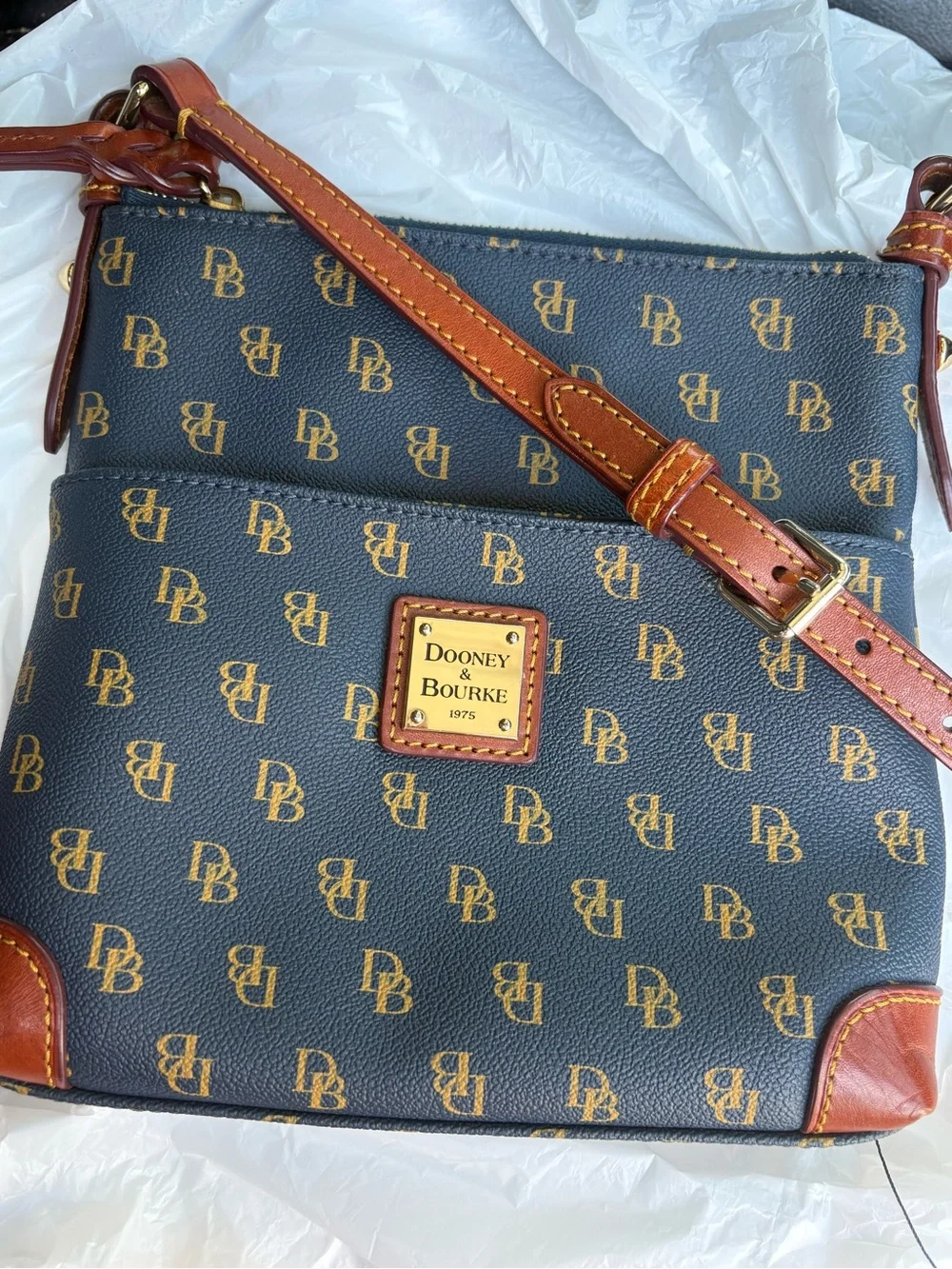 Dooney & Bourke navy with Brown Trim Monogram Crossbody